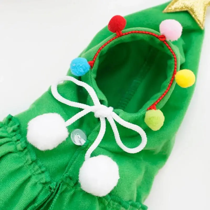 Green costume hood with pom-pom ties