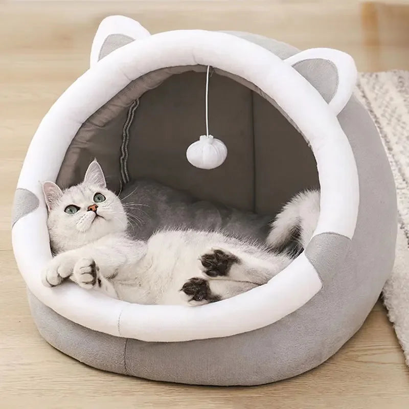 Cat relaxing in the Self-Warming Cat Cave in Grey & White